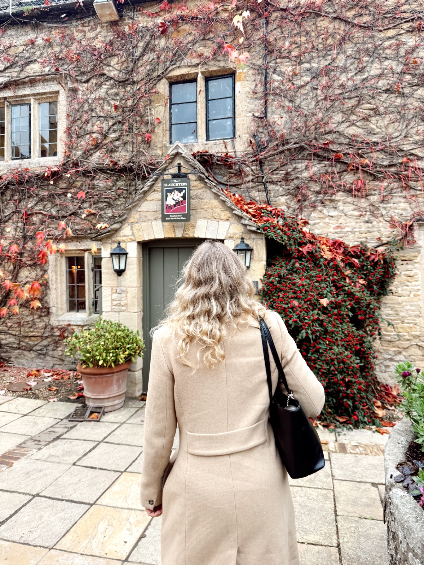 Ivy-covered Cotswolds inn on an autumn afternoon